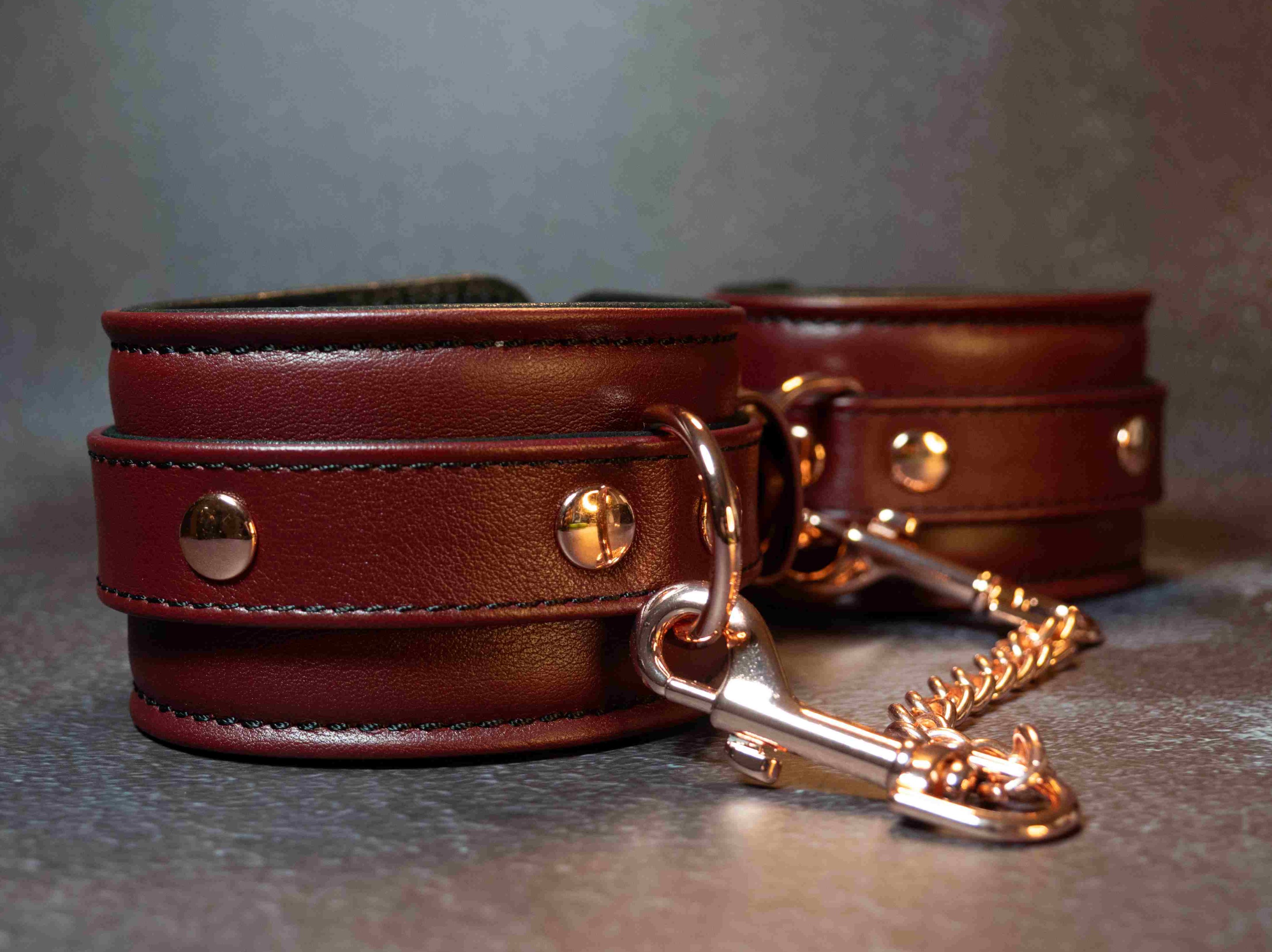 Metal links, attached to the wrist cuffs