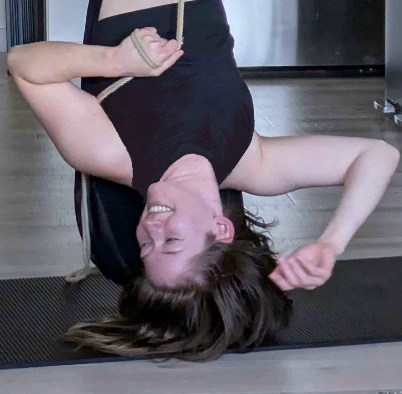 Jess self-suspending with rope, upside down